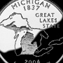 Michigan State Quarter - zeigt die Umrisse des Staates und seinen Spitznamen: The Great Lakes State